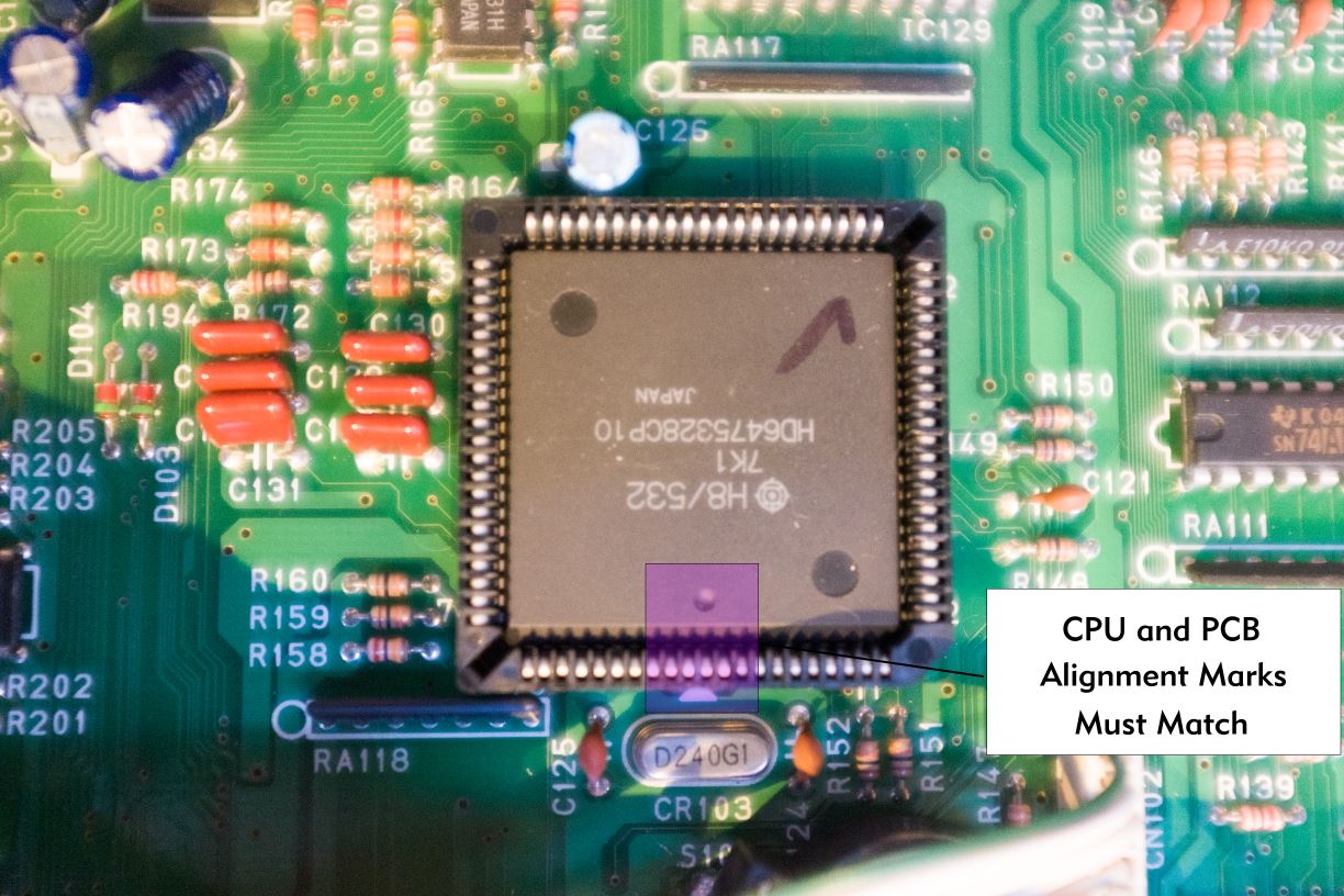 Closeup picture of the SY99's CPU on the DM1 board, highlighting the alignment markings.